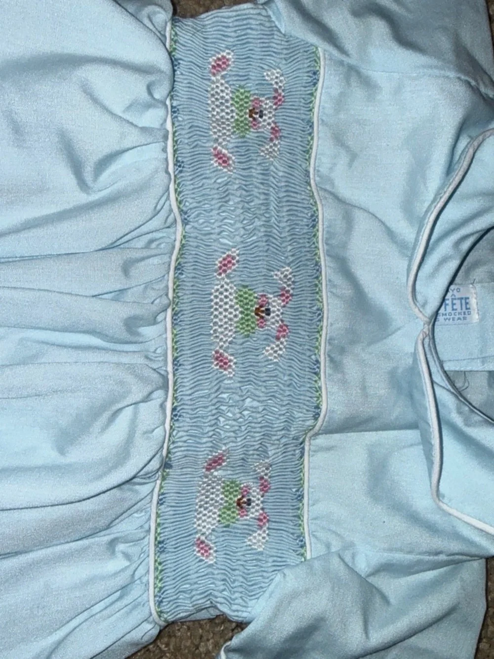 Baby blue smocked romper with embroidered floral design size 24m